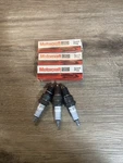 Pack Motorcraft Spark Plugs AGR32C. Fixed Price $6.97.
