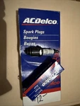 The Image Shows Box Of Acdelco Spark Plugs, Used. Fixed Price $14.00.