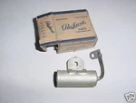 1941-47 Packard Six Ignition Condenser 354165 Nos. Fixed Price $15.00.